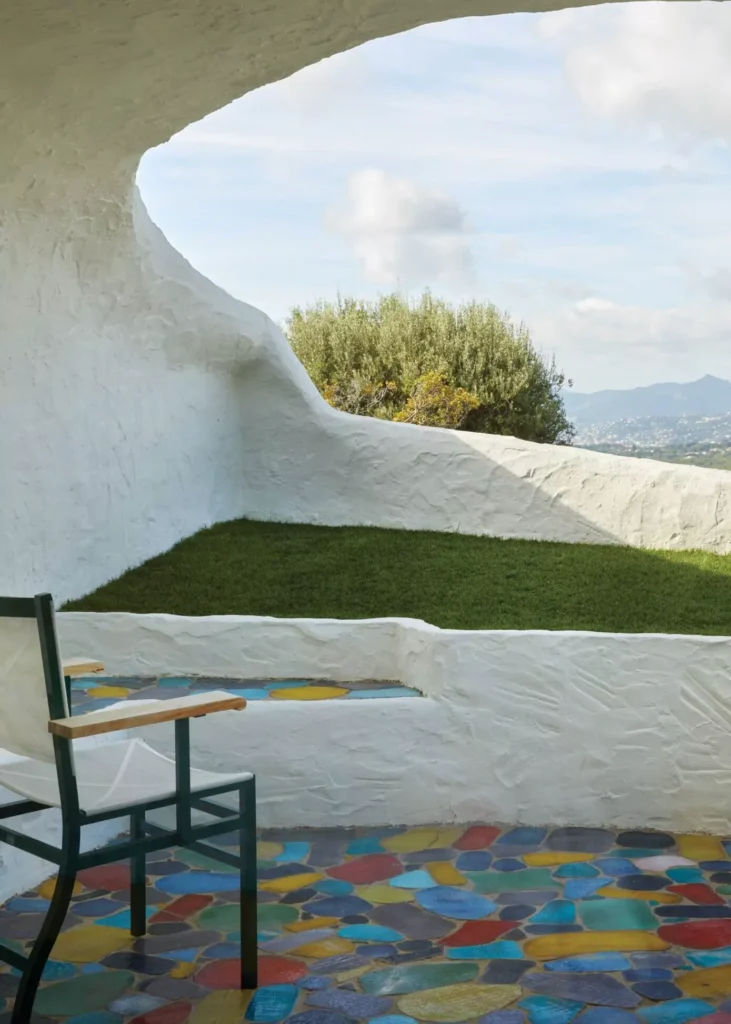 A terrace offers sweeping views of the landscape beyond