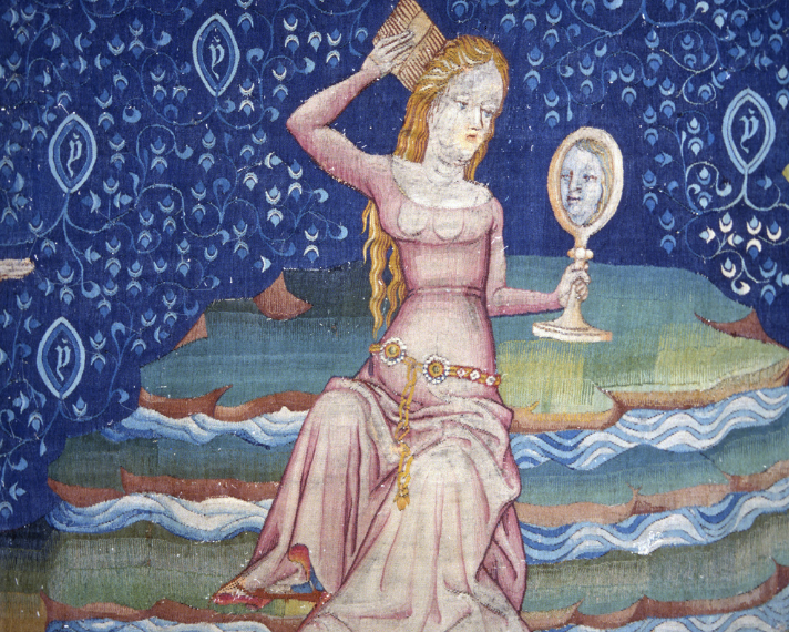Apocalypse Tapestry, detail of a woman at her toilet. Scene “The Great Whore on the Waters”. Photograph taken from the reverse side.
